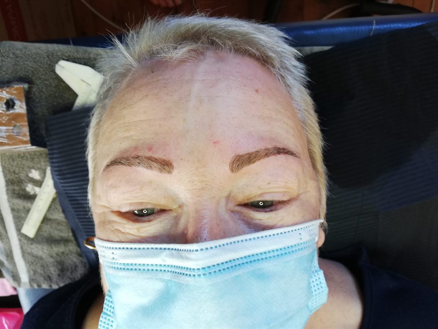 The same client with full, defined brows after microblading